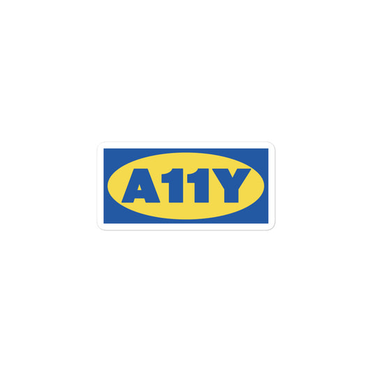 Thick blue A11y letters, on top of a yellow oval, on top of a blue rectangle. Remicent of the Ikea logo. Center aligned on 3 inch sticker.