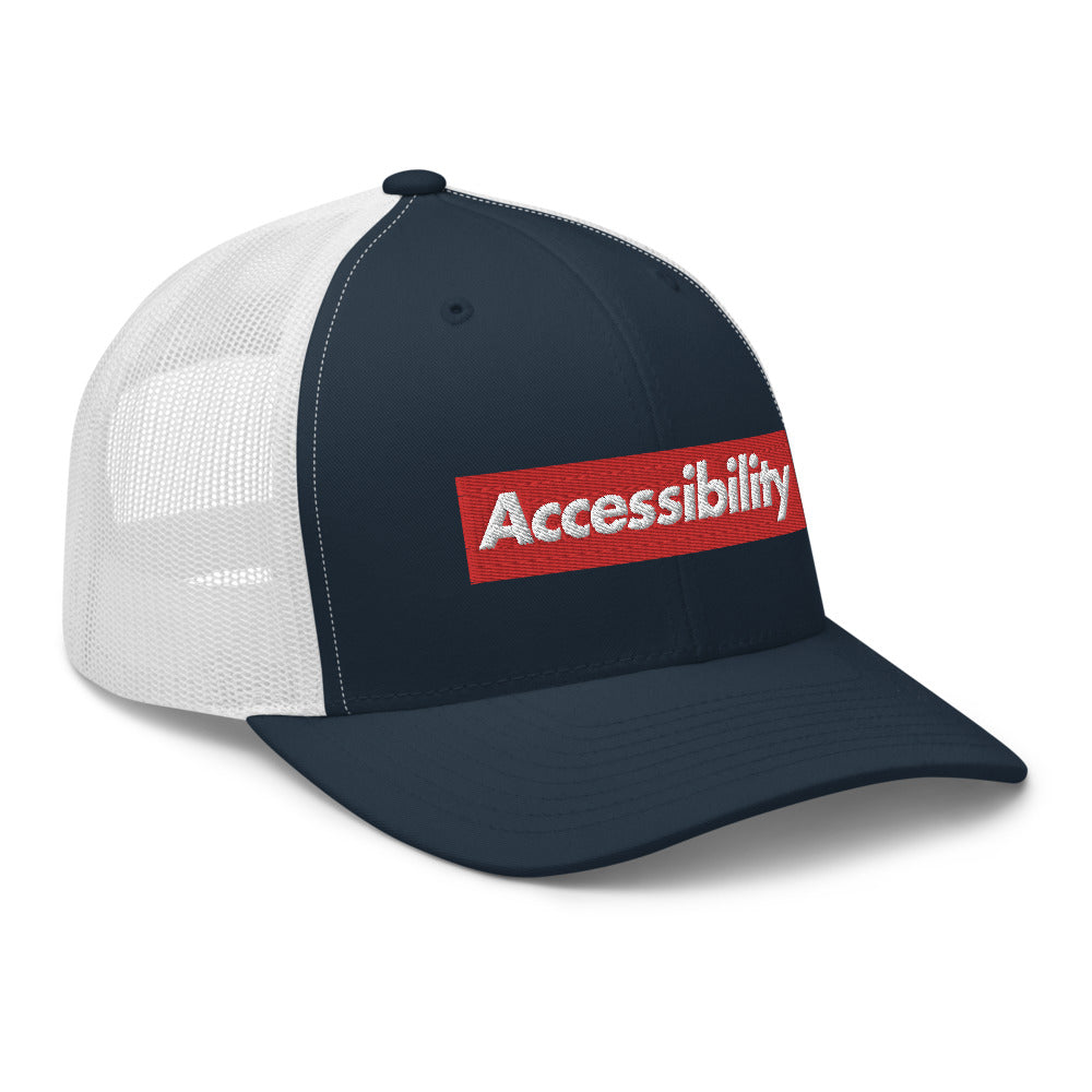 Angle view of blue front trucker hat shows text logo design on front of hat with white mesh backing.