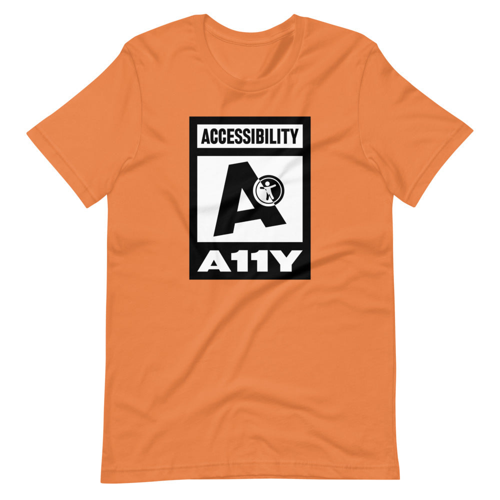Black on white Accessibility word above large black letter A. Black universal design logo on white is placed above a white on black A11Y word, center aligned, on front of orange t-shirt.
